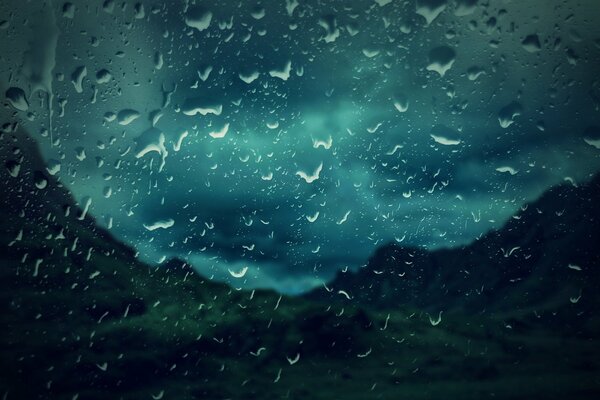 View outside the window, glass in raindrops