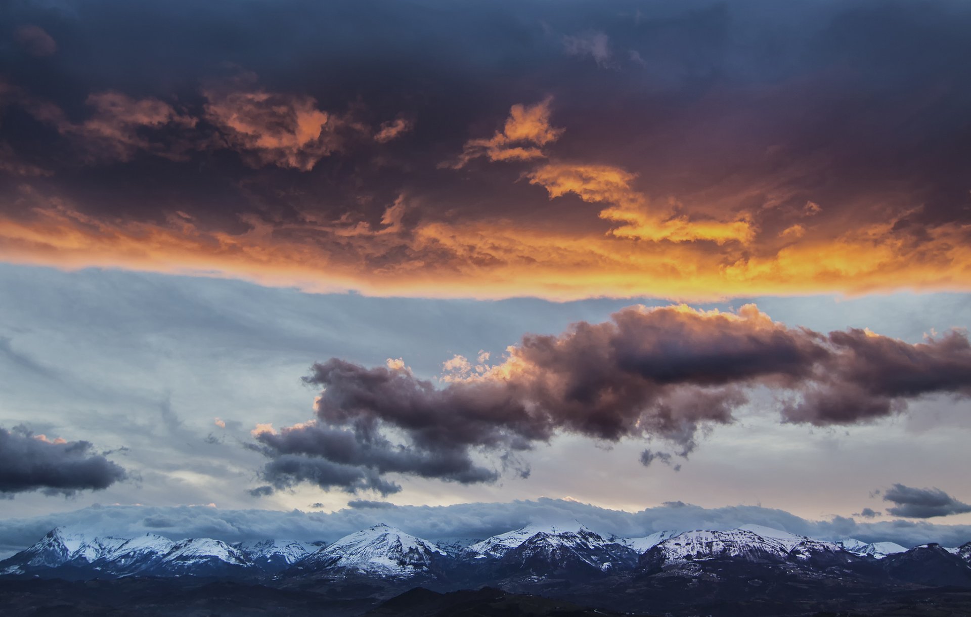 italy apennines mountain tops snow haze night sky clouds landscape