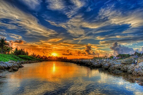 Sunset over the river. clouds in the sky