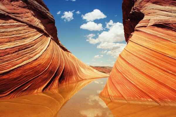 Multicolored rocks on the background of water and sky