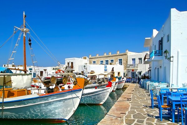 Southern landscape, boats on the pier at the houses