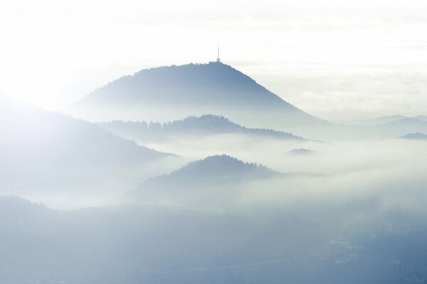 Hills amid thick fog