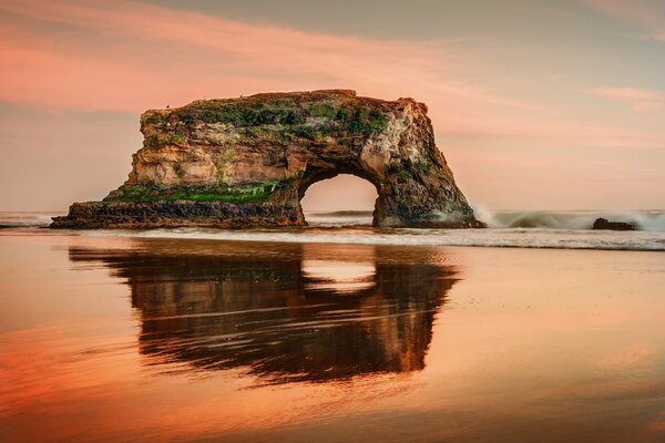 Rocks in the sea. Reflection on the water