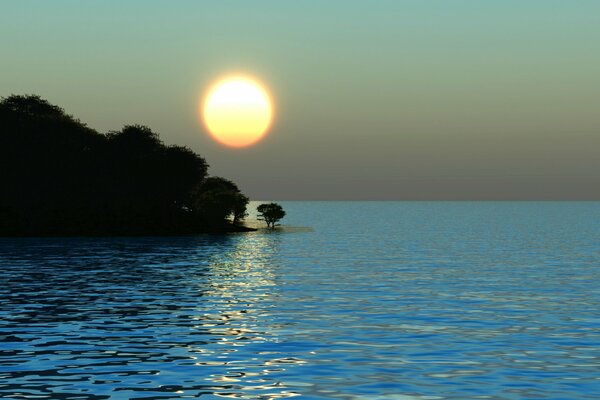 The setting sun in the blue sea