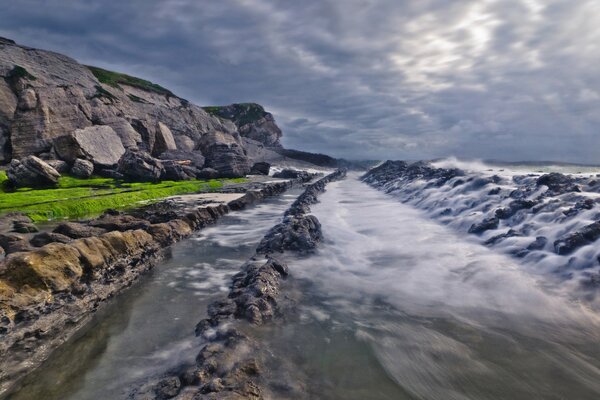 Waves on the rocky coast of the sea