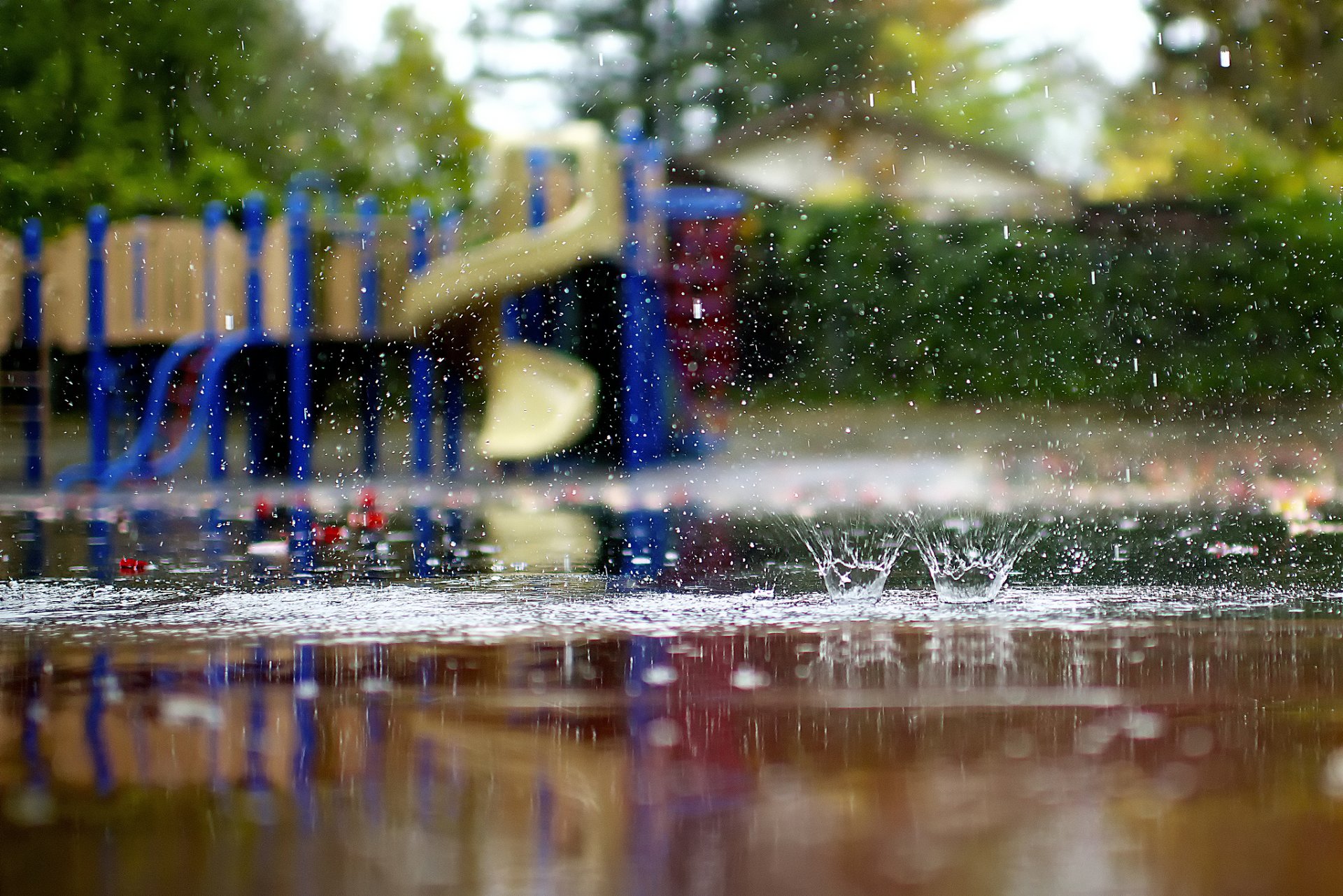 close up playground rain pools spray autumn lucydphoto