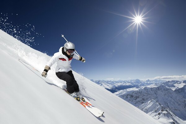 Mountain skiing on a snow descent