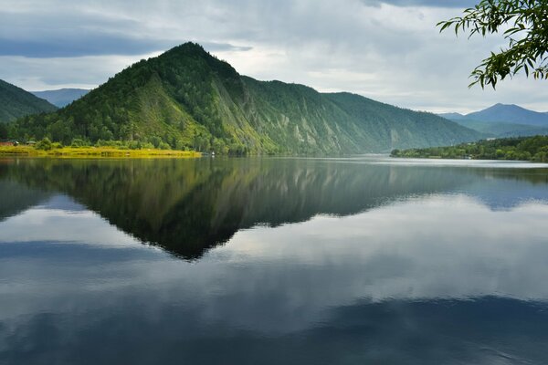 Reflection of the mountain range on the surface of the lake