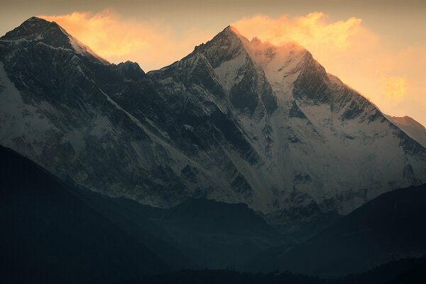 Mount Everest is snowy against the sky