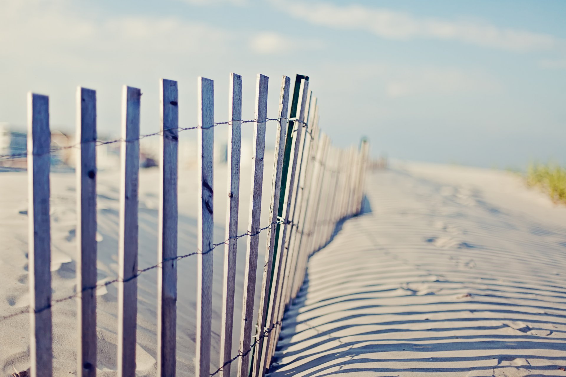 fence beach traces sky