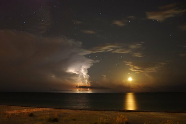 Moon and lightning in the Gulf of Mexico sky