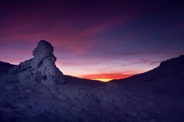 Gray rocks, scarlet sunset