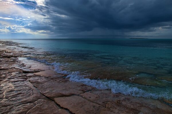 Shore on the open blue sea