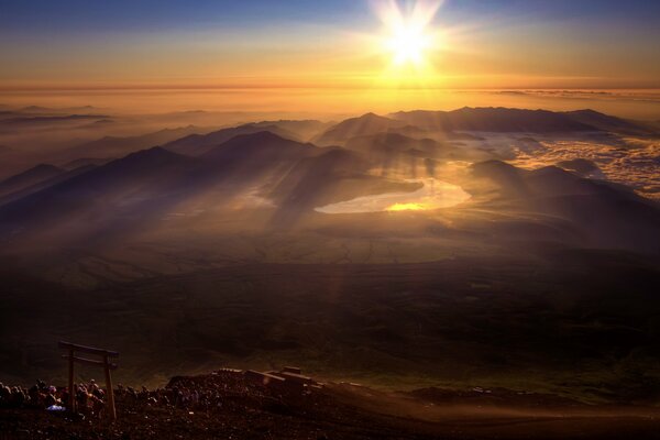 The orange sun shines through the transparent air