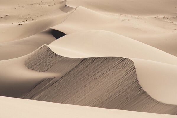 Endless dunes in the beige desert