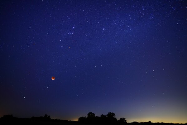 Blue Night sky with moon and stars