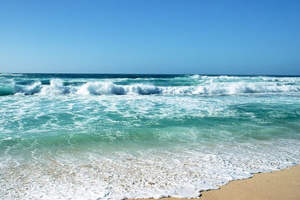 Beach on the sea with waves on the sand