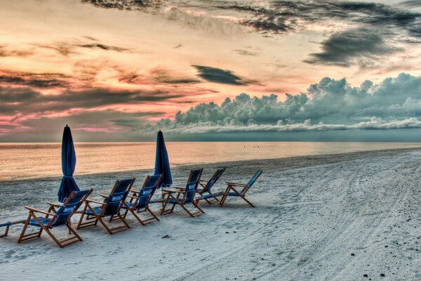 Sunbeds on the beach with snow-white sand