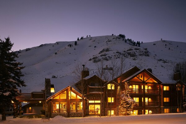 Big house on a mountain background in winter