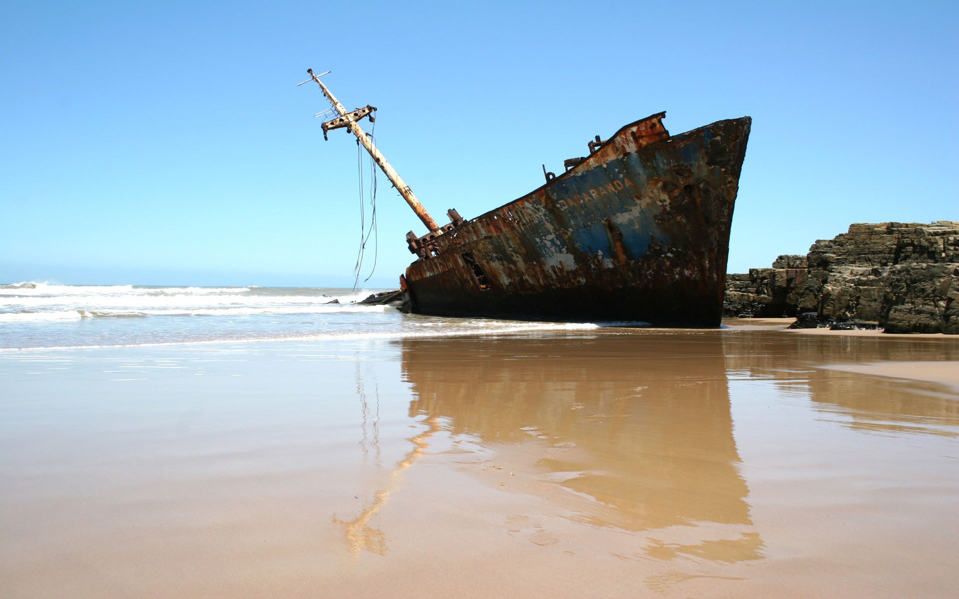 beach shore old boat sky