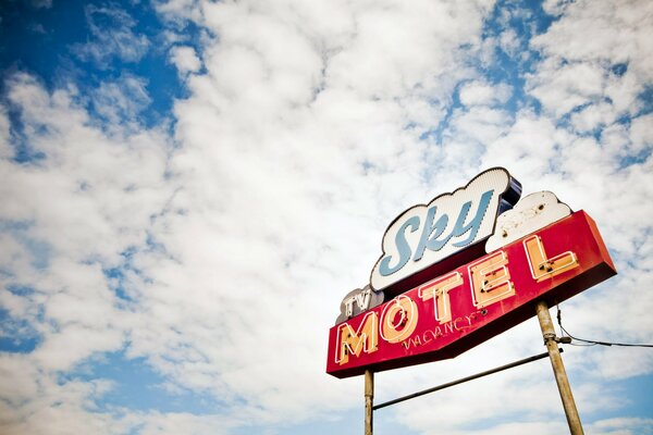 The sign of the motel against the sky