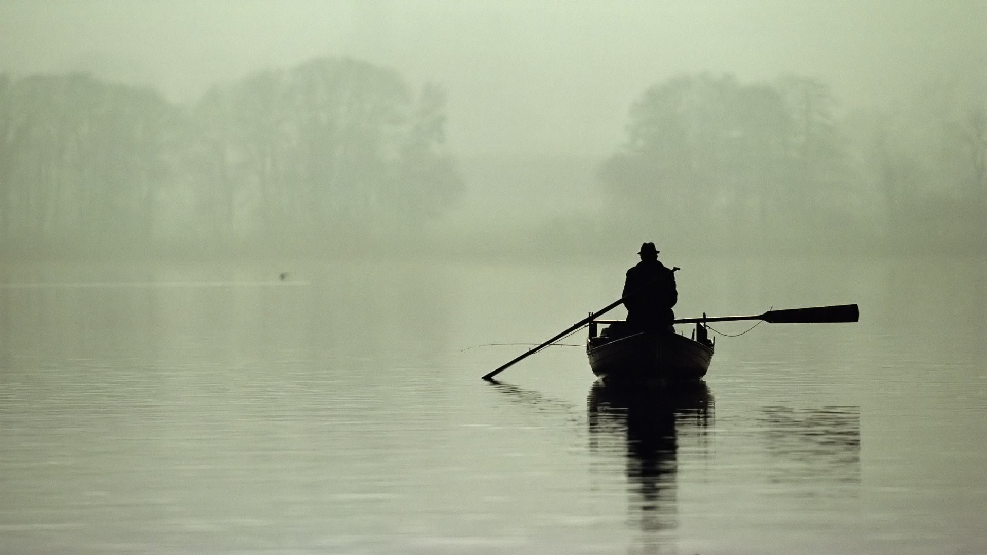 morning fog lake boat a fisherman