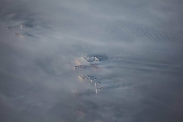 A bird s-eye view of the house through the fog