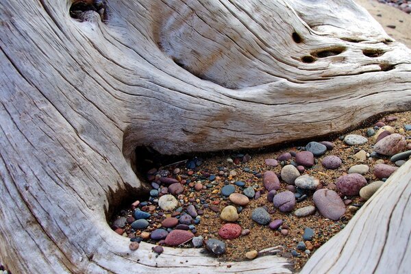 Multicolored stones on the sand