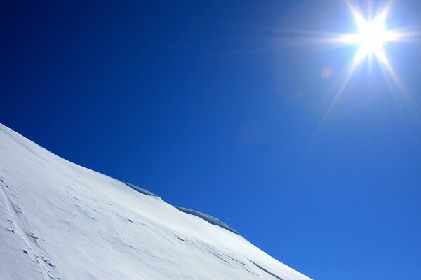 Blue slope in winter in the sun