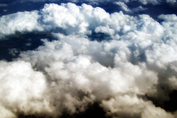 In flight over white cumulus clouds