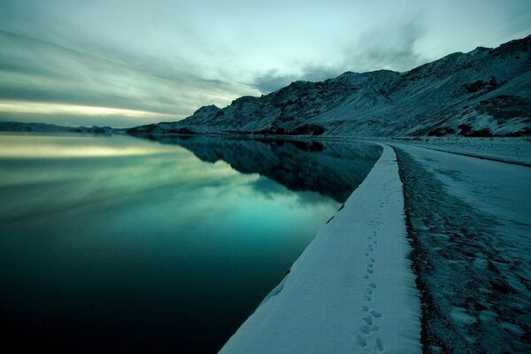 Footprints in the snow adol water