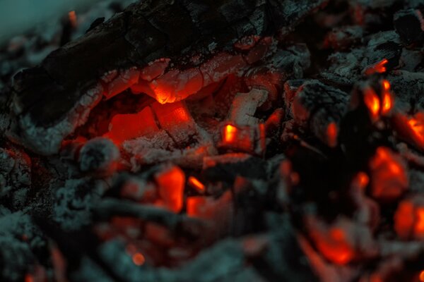 A dying fire smoldering in the coals