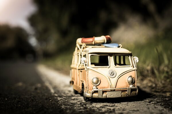 Photo of a minibus model on the asphalt. Macro shooting