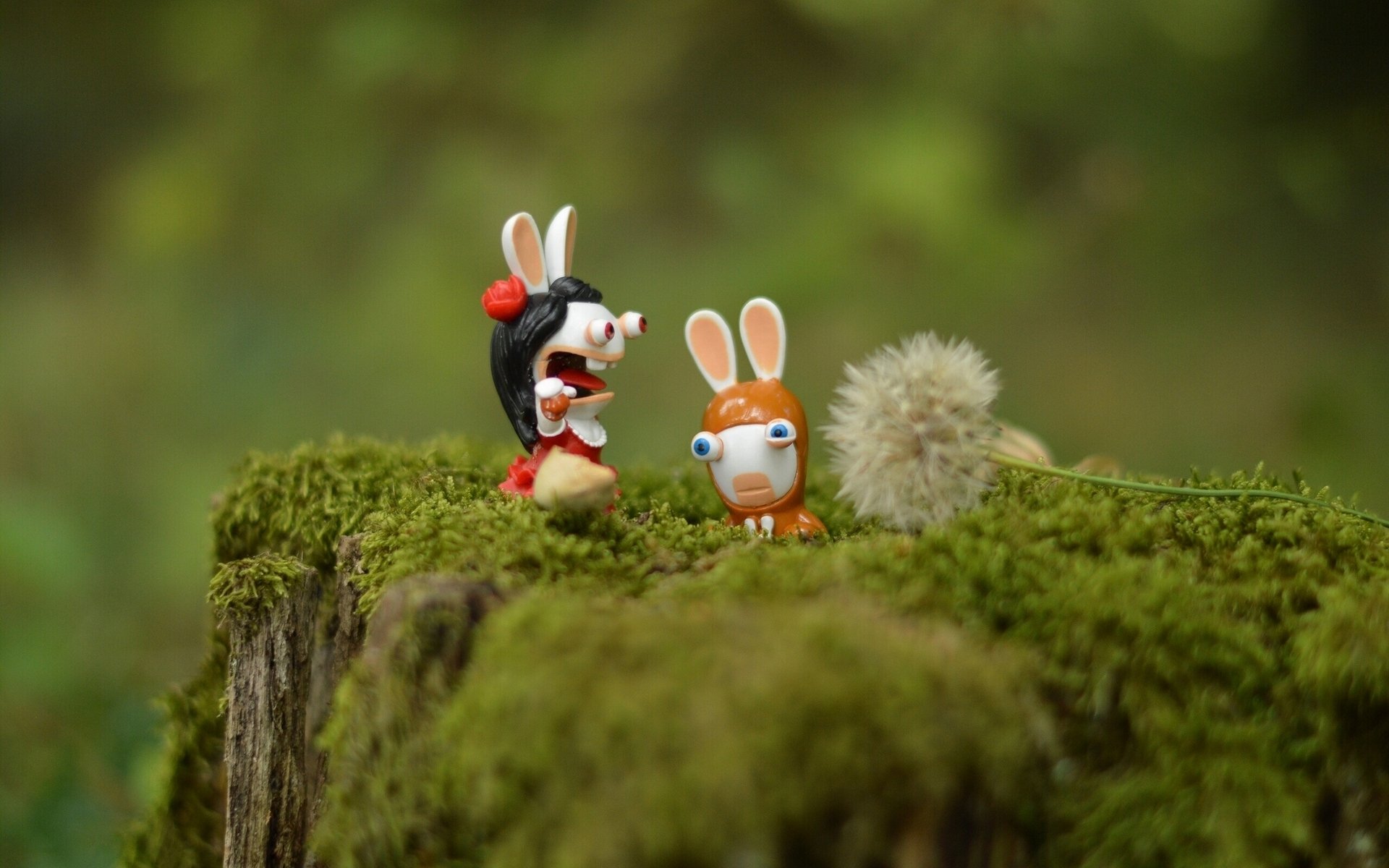 toys rabbits stump moss close up