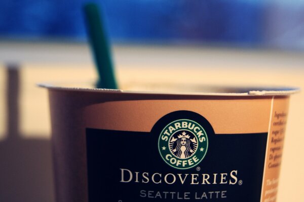 Paper coffee cup with Starbucks logo