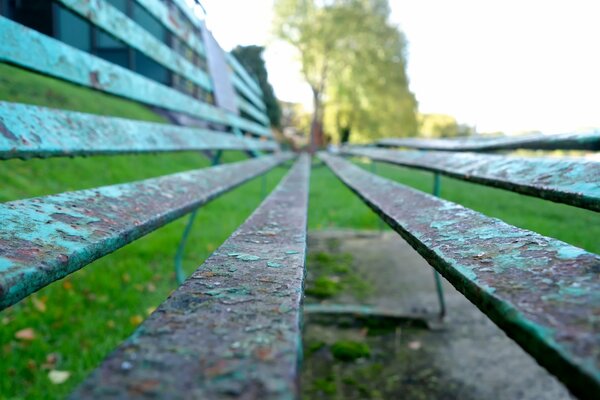 Blue bench with peeling paint