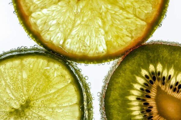 Close-up photo of kiwi orange and lime cut