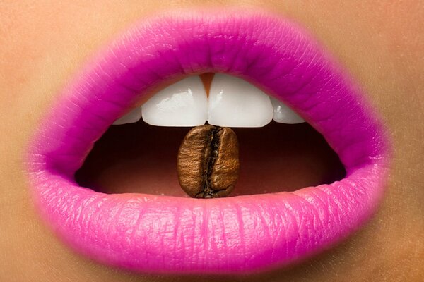 Coffee bean in a girl s mouth