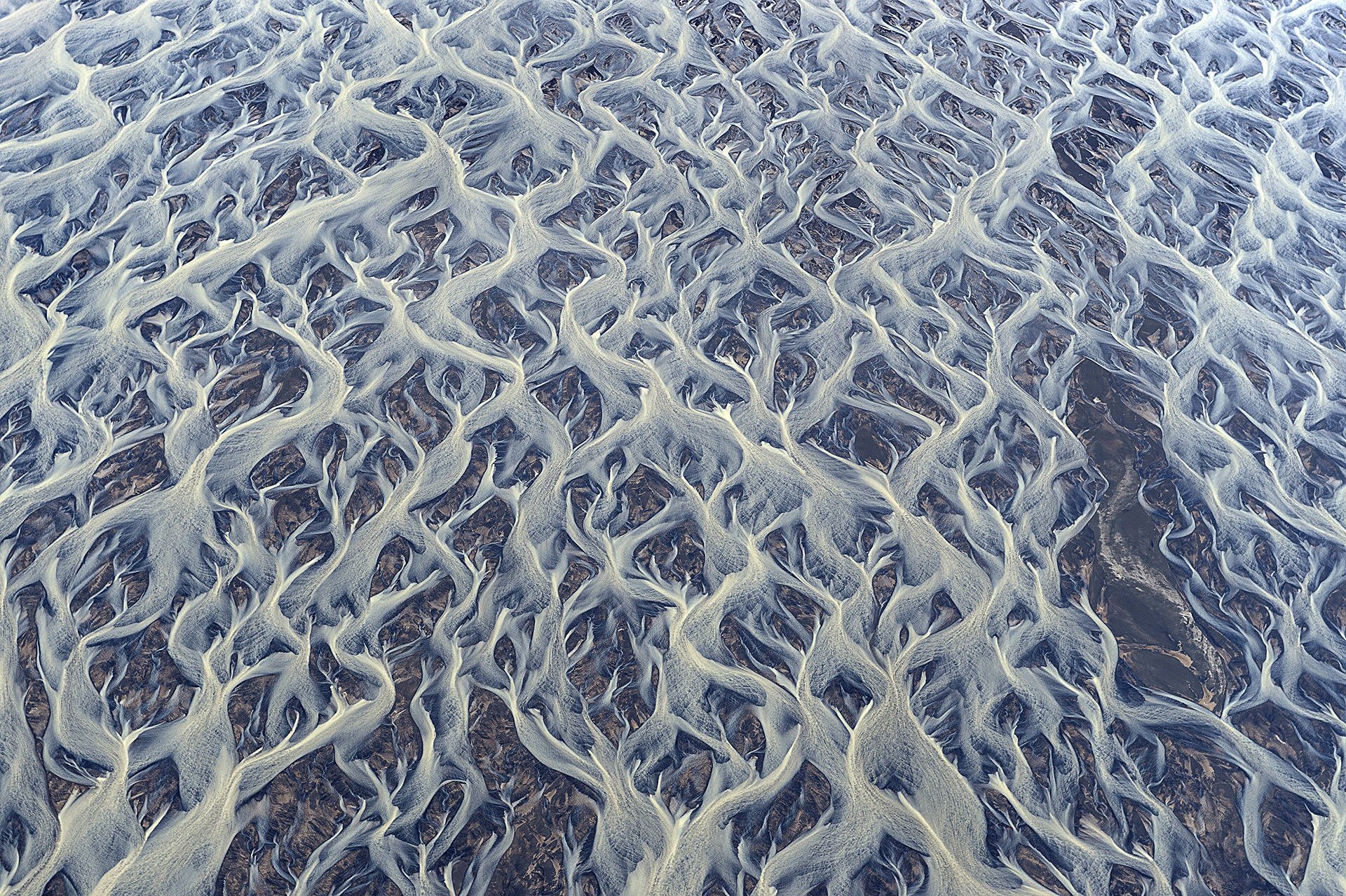 islandia paisaje abstracto ríos arroyos arroyos polvo volcánico barro glacial textura patrones vista superior