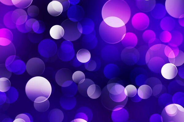 Destellos de luz con círculos de color púrpura combinados con azul