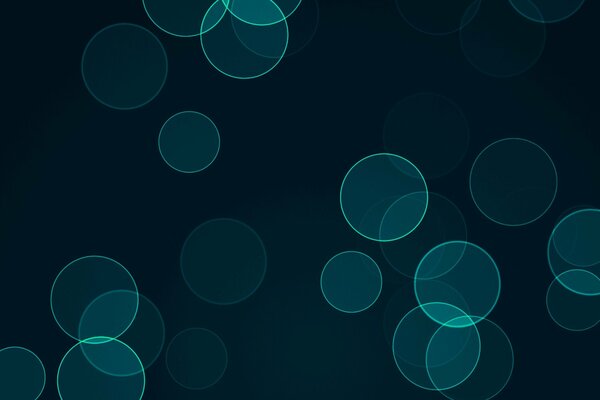 Abstract green circles on a dark background
