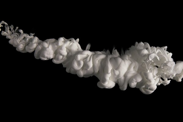 Clouds of white foam on a black background