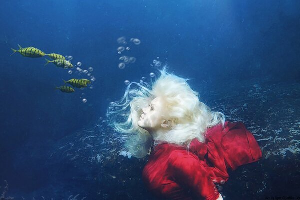 Blonde girl underwater