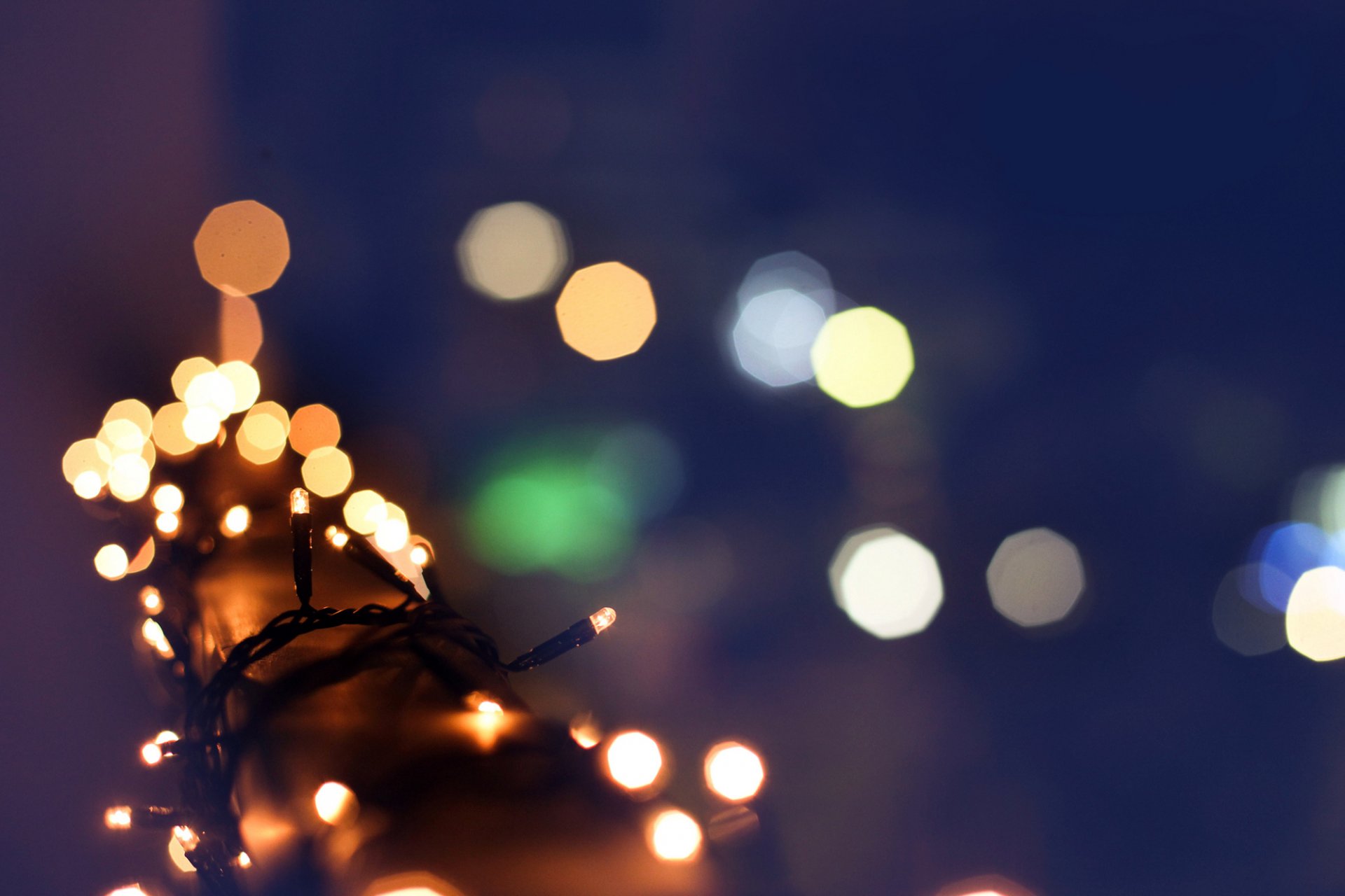 garland lights orange yellow rails holidays winter bokeh blur close up