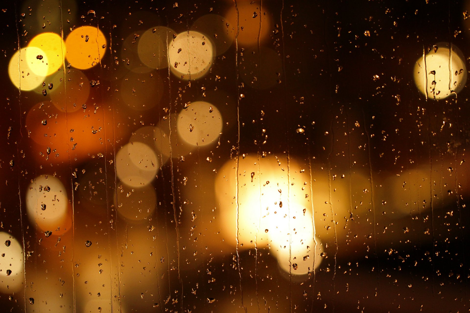 rain glass drops brooks running bokeh reflections blur lights town night rainy night mood sadne