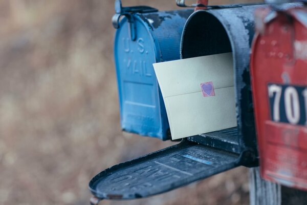 An envelope with a heart in the mailbox