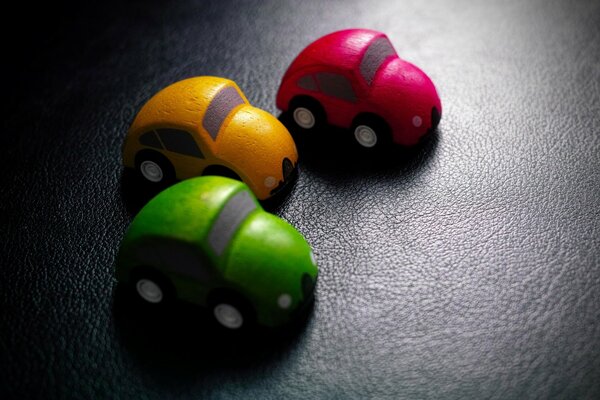 Three Colorful toy cars