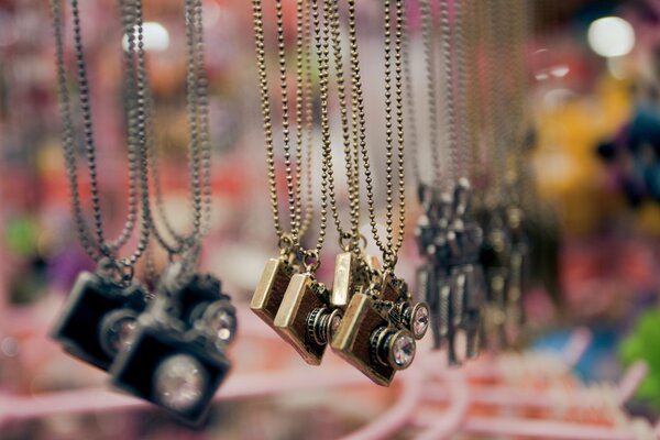 Pendants in the form of a camera on a chain