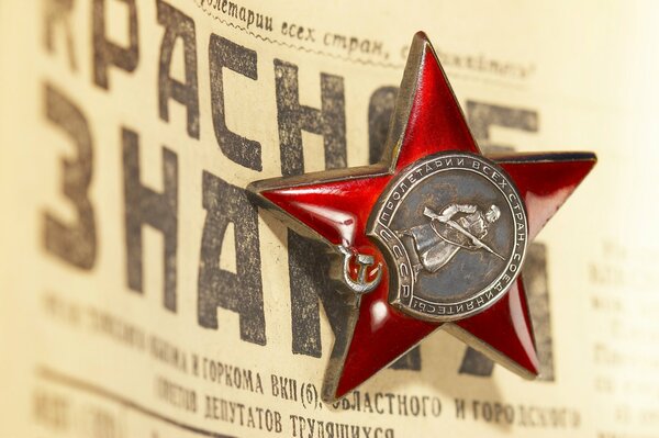 The Red star of the USSR on the newspaper