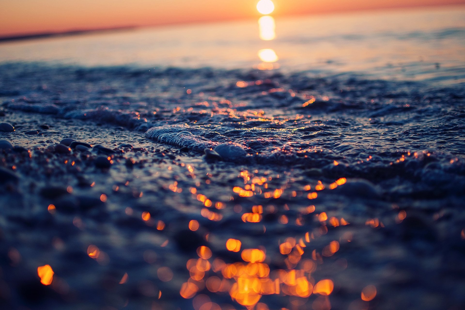 close up wet sea foam reflections light heat